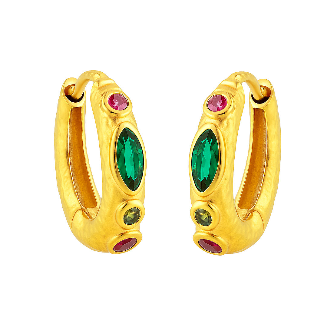 Gold hoop earrings with green and red gemstones on a white background