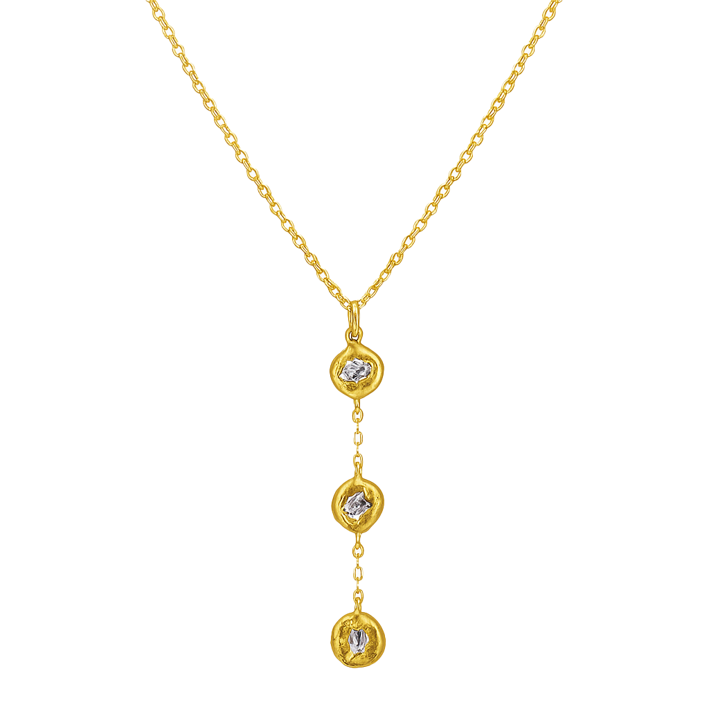 Gold necklace with three diamond pendants on a white background