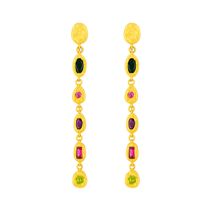 Gold earrings with colored gemstones on a white background