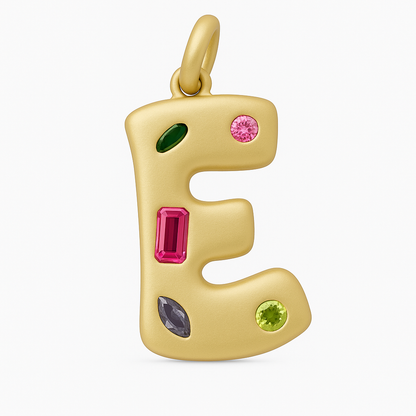 Gold pendant shaped like the letter 'E' with colorful gemstones on a white background