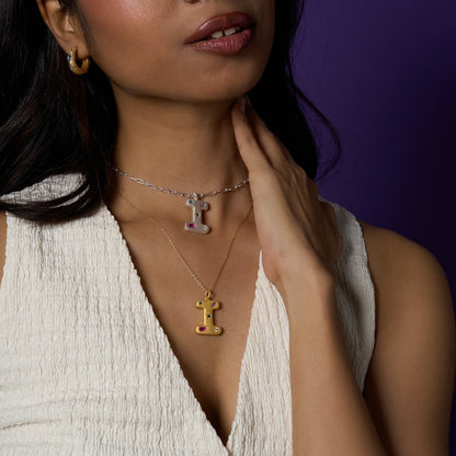 I alphabet pendant in gold and silver tones