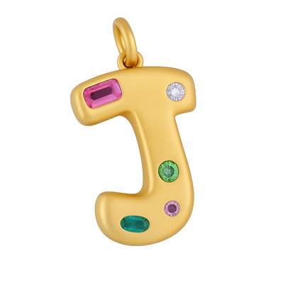 Gold letter 'J' pendant with colorful gemstones on a white background