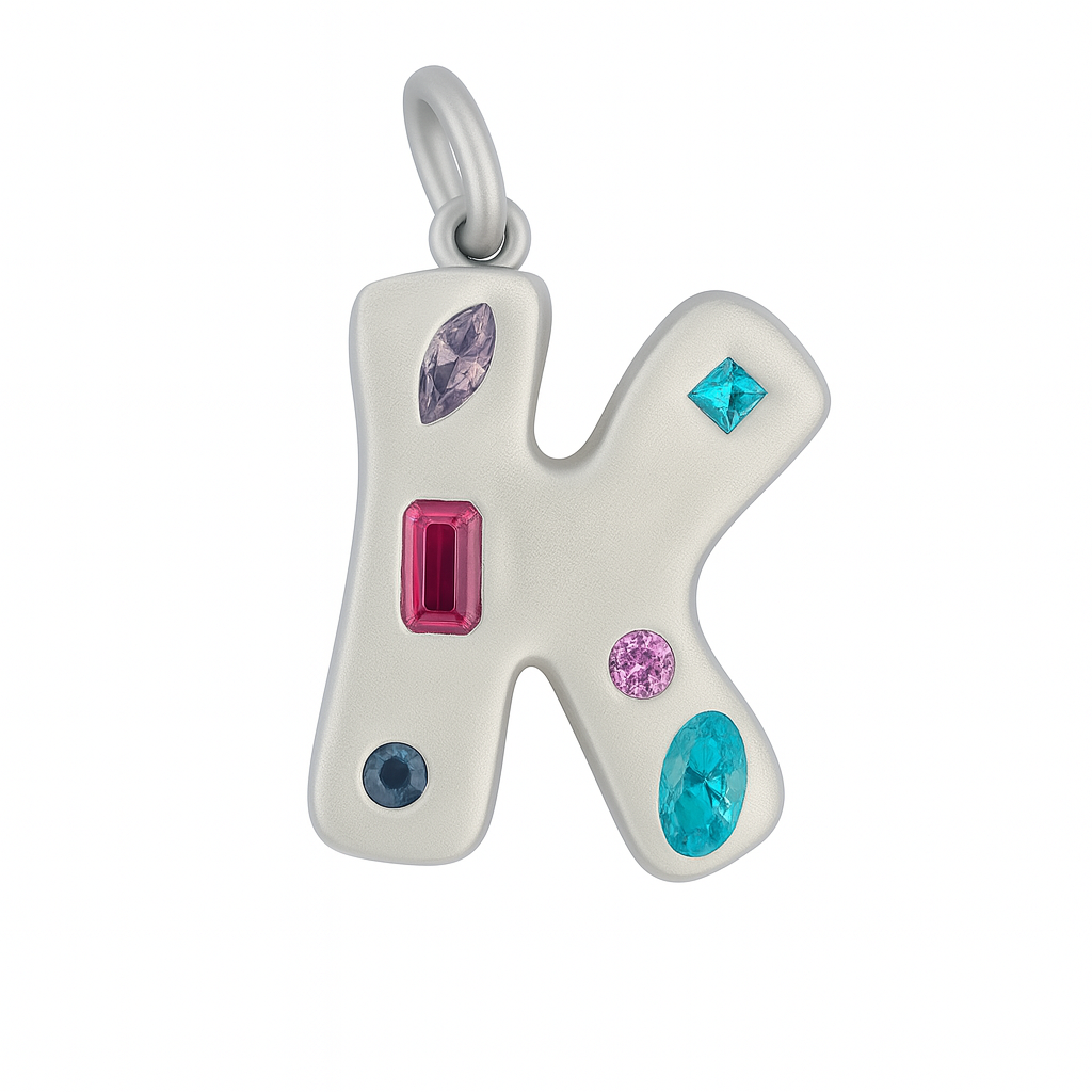 Silver letter 'K' pendant with colorful gemstones on a white background