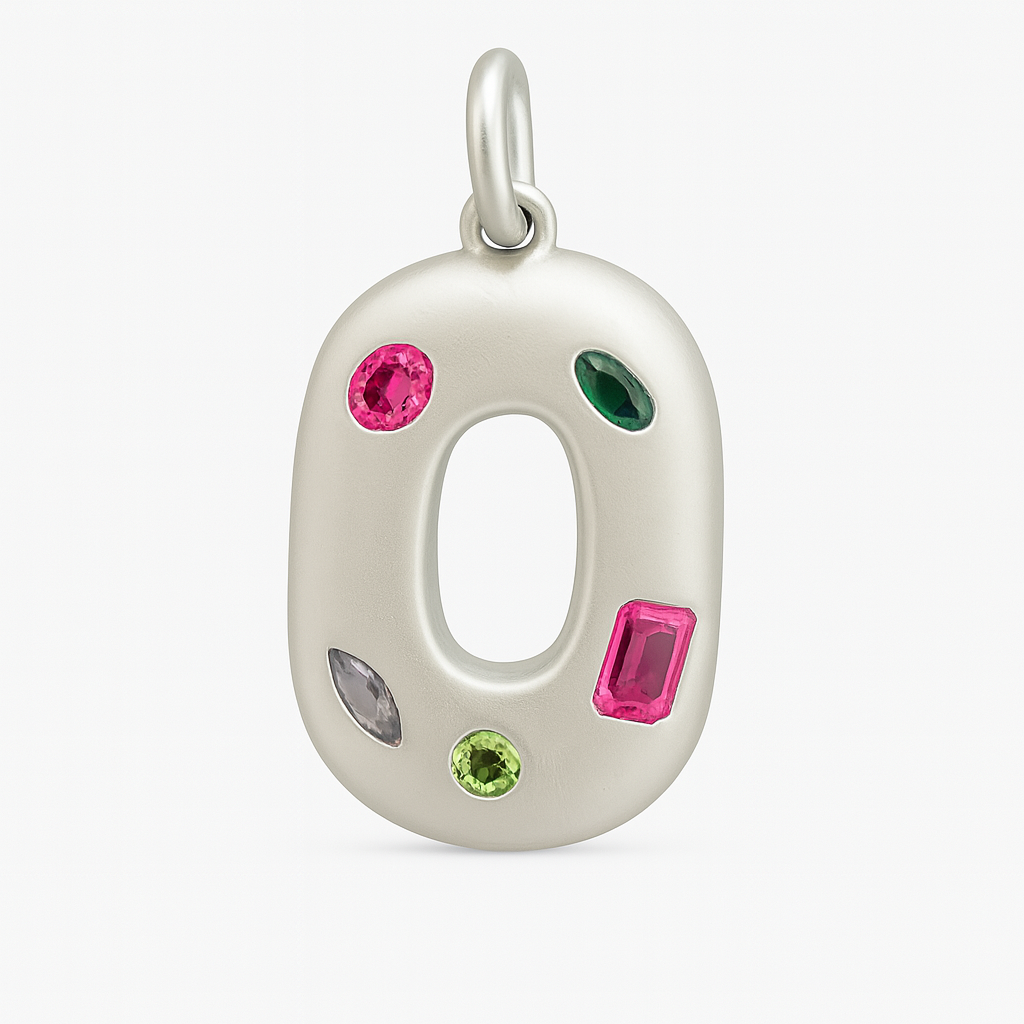Silver O shaped pendant with colorful gemstones on a white background
