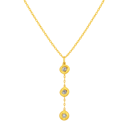 Gold necklace with three heart-shaped pendants on a white background