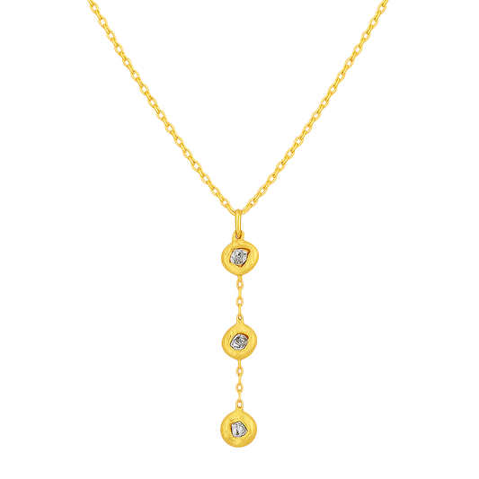 Gold necklace with three heart-shaped pendants on a white background